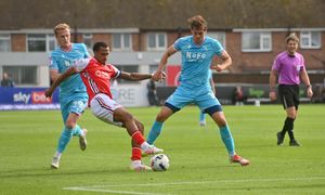 Walsall striker Aaron Pressley challenges for the ball.