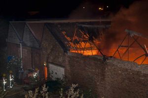 The blaze was fanned by strong winds and gutted four industrial units. Photo: Nigel Gooding.