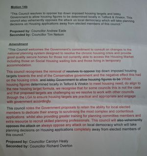 An original Conservative motion appears at the top of this sheet of paper and an amended motion appears below with lots of red in across the 