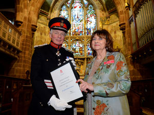 Supporting image for story: Community stalwart presented with award in Wem