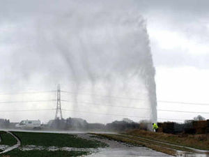 Supporting image for story: Water shoots 100ft in the air as pipe blows