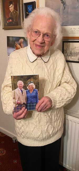 Joan Dabbs holds a photo she received from the King and Queen for her birthday. 