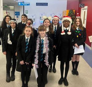 Schoolchildren at hospital carolling for charity