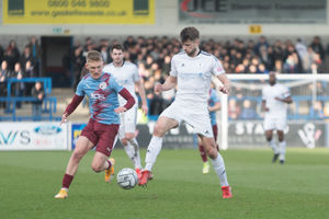 Gateshead Player Greenfield pressuring Jason Oswell as Gateshead look to get the ball back (Kieran Griffin)