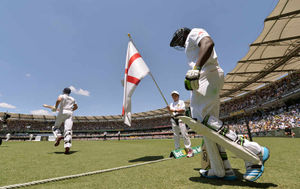 England's Alastair Cook (left) and Michael Carberry (right) take to the field to open the batting