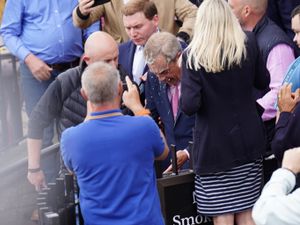 Supporting image for story: Nigel Farage doused with milkshake outside pub