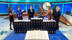 Tom being presented with the trophy by the show’s resident mathematician Rachel Riley
