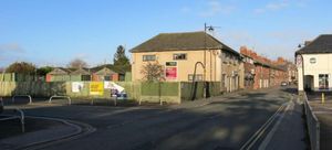 The semi-derelict site lies on the corner of New Street.