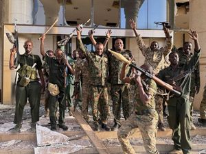 Soldiers celebrate before the palace