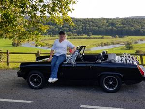 Beverley Shingler-Day with her MG Midget, bought for her 60th birthday by husband Malcolm