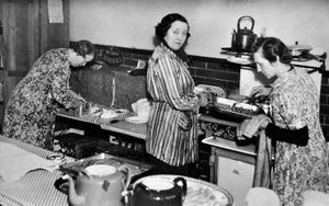 'Mrs J Cliff Tibbits, Mayoress of Walsall, helps in the canteen for service men in Hatherton Road every weekend by cooking and serving. With her in this group, taken today, are Mrs L Summers and Mrs Wilfred Brown.' There is no date, although appears to be from World War Two. 