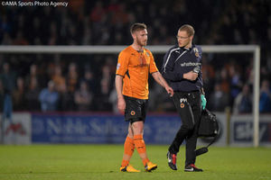 Wolves' James Henry leaves the pitch with an injury
