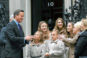 David Cameron welcomes a Poppy Bus and Barbara Windsor to Downing Street