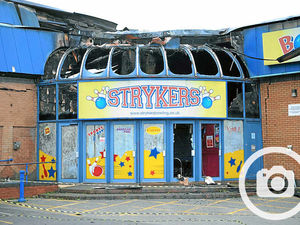Supporting image for story: The shell of Strykers - Probe begins on bowling alley fire
