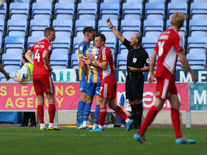 Supporting image for story: Shrewsbury Town's Tom Flanagan available for EFL Cup after successful red card appeal