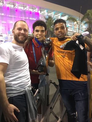 Gibbs-White with academy boss Gareth Prosser (left) and father Kirk shortly after his World Cup win