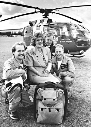 Joan Ash of Codsall, visited the West Midlands Air Ambulance at RAF Cosford after they rescued her from her car after a crash on the A449 at Coven, as part of a fundraising drive. The photograph shows Joan Ash with (left to right) Dave Goodwin, Nick Broad and Garry Evans on July 28, 1992.