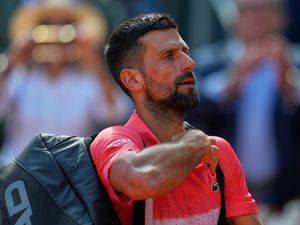 Novak Djokovic of Serbia leaves the court