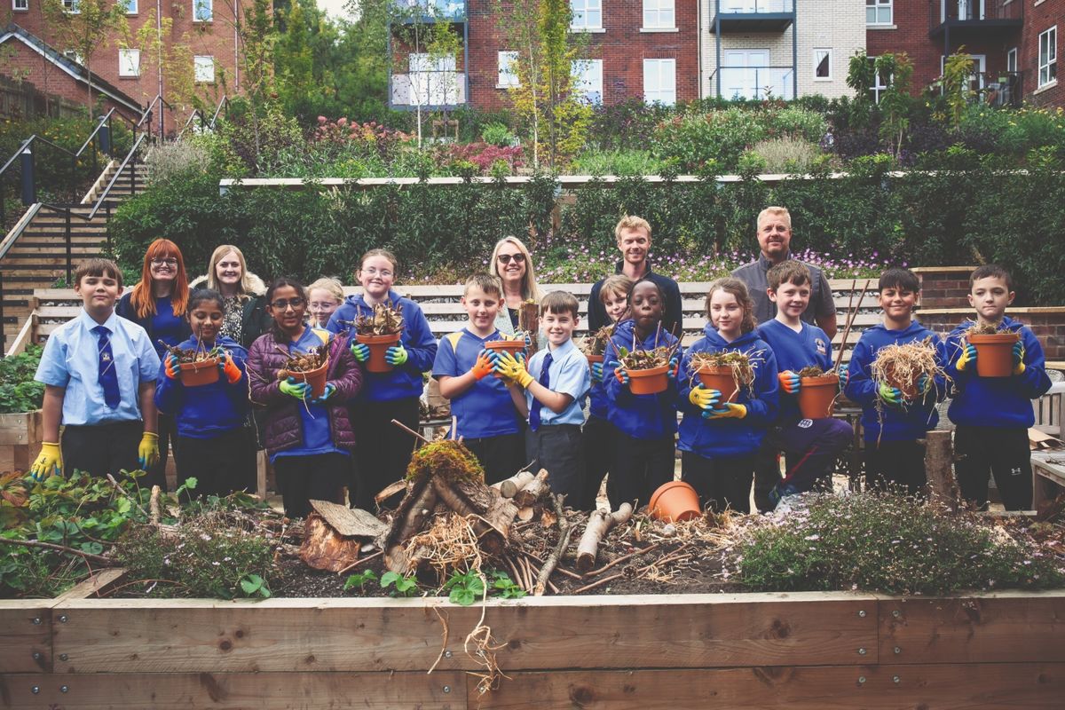Schoolchildren and retired homeowners come together to celebrate gardening and nature