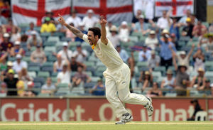 Australia's Mitchell Johnson celebrates taking the wicket of England's Tim Bresnan