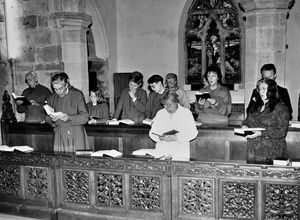 The congregation and villagers at Claverley Church in 1989 in a hymn singing marathon fundraiser. The caption reads: 'The congregation of Claverley Church made a noteworthy contribution to an appeal to raise money for new choir robes. Pictured are some of the villagers in the sponsored musical marathon who sang a total of 636 hymns for the fund.'