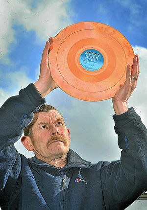 Ian Jones with the gold disc that was presented to rock supergroup Power Station