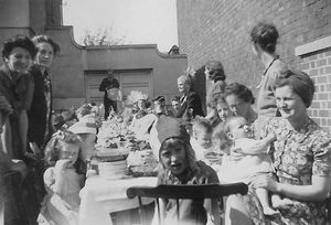 A party at the Prince of Wales, Bynner Street, Shrewsbury. The girl in the centre is thought to be Mary Yeomans, with her mother standing left with a Mrs Strain. 