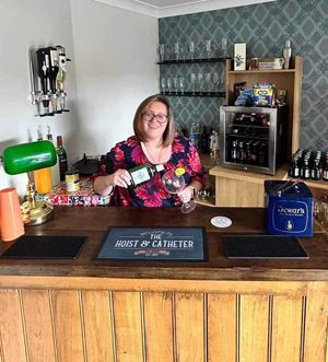 Fiona Brewin preparing a few drinks behind the bar