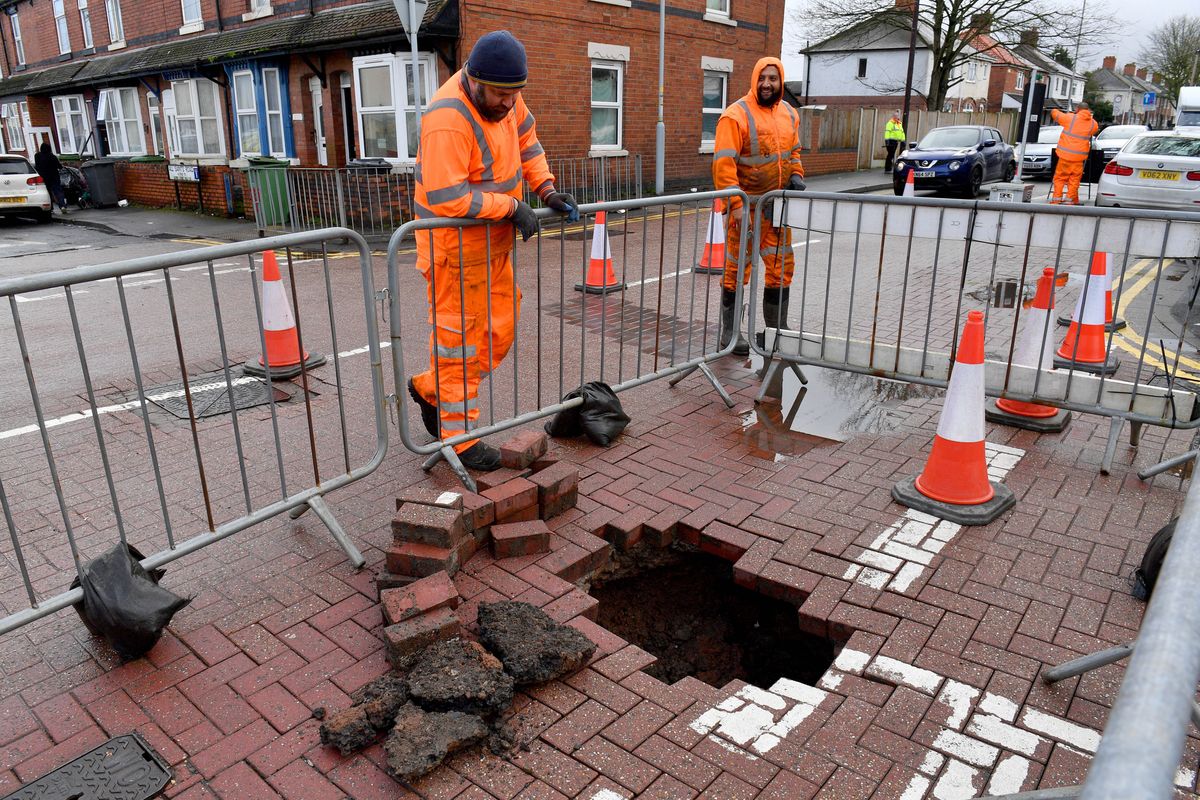 Pictured: Nine alarming photos of a Wolverhampton sinkhole as residents talk of shock at sudden appearance of a hole in a road Pictured: Nine alarming photos of a Wolverhampton sinkhole as residents talk of shock at sudden appearance of a hole in a road