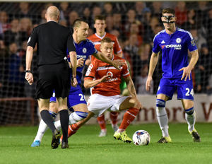 Walsall's Jason Demetriou and John Terry                                                                                                                                                                                                                                                                                                                                                                                                                                     .