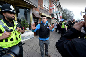 A police officer speaks to the media in Hagley Road, where armed police raided a flat on Wednesday