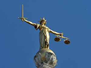 The Lady Justice statue atop the Central Criminal Court, also referred to as the Old Bailey, London.