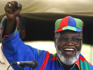 Sam Nujoma gestures while speaking during an election rally