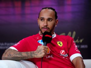 Ferrari driver Lewis Hamilton addresses the media in Bahrain