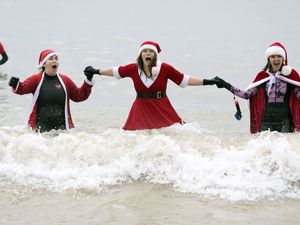 Supporting image for story: In Pictures: Plucky bathers take a Christmas dip