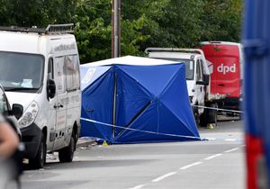 The body of a woman was found at the scene early on Monday morning