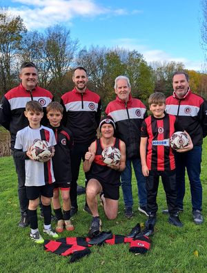 Back row, from left: Jon Tudge, Under-15 Girls Whites Manager, Mike Walters, Under-11s Reds Manager and Treasurer, Keith Davies, walking footballer, Dan Broster, Under-12s Blacks Manager and Junior Chair. Front row: George Walters and Frankie Tudge, Under-11s Reds Players, Tim Nash and Harvey Broster,