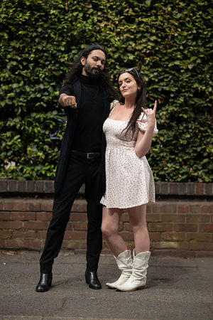 Music fans Raphael Lima (L) and Kaley Cane (R) arrive to attend British rock band Black Sabbath's "Back to The Beginning" concert, Ozzy Osbourne's final ever gig as Black Sabbath's frontman at Villa Park in Birmingham, central England on July 5, 2025. Osbourne, who revealed in 2020 that he has Parkinson's disease, will join Tony Iommi, Geezer Butler and Bill Ward for the all-day "Back To The Beginning" show in Birmingham, central England, where the heavy metal giants formed in 1968. (Photo by Oli SCARFF / AFP) (Photo by OLI SCARFF/AFP via Getty Images)          