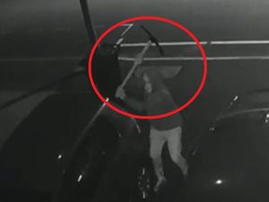 Supporting image for story: WATCH: Axeman caught on camera swinging pickaxe through car roof