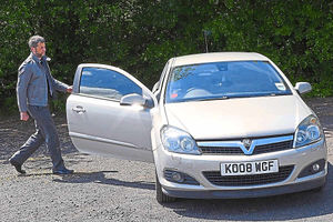 Breathless already, Karl Aston gets into his car