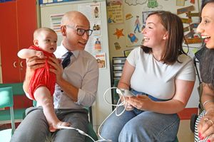 Health minister Stephen Kinnock is left holding the baby during a visit to Russells Hall Hospital in Dudley.  Mr Kinnock is pictured with Alex Perry, 28, from Halesowen, and daughter Mabel, age five months. Dudley MP Sonia Kumar looks on.