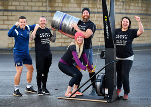 The challenge involves somebody using a skiing machine whilst somebody else has to hold a keg 