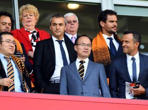 Fosun chairman Guo Guangchang, centre, at Molineux