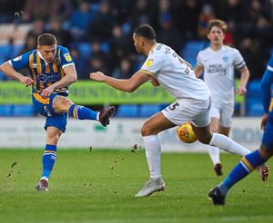 Greg Docherty of Shrewsbury Town scores a goal to make it 1-0. (AMA)