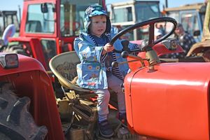 Lucas O'Rourke gets a feel for the driver's seat in a vintage tractor