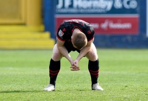 A dejected Danny Johnson after Walsall's defeat at Barrow last weekend.