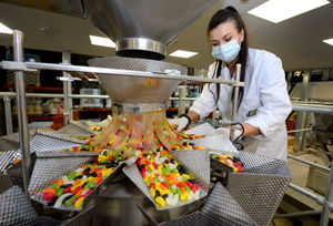 Anna Szymczyk checks on the sweets as they are packaged