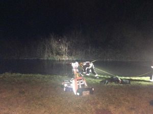 Crews work to remove the car from the canal, picture: Andrew Rainey
