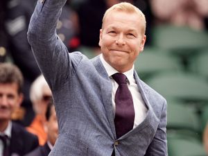 Sir Chris Hoy waving