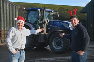 Tom Wellings (in the cheque) and Josh Barratt, founders of the Christmas Tractor Run